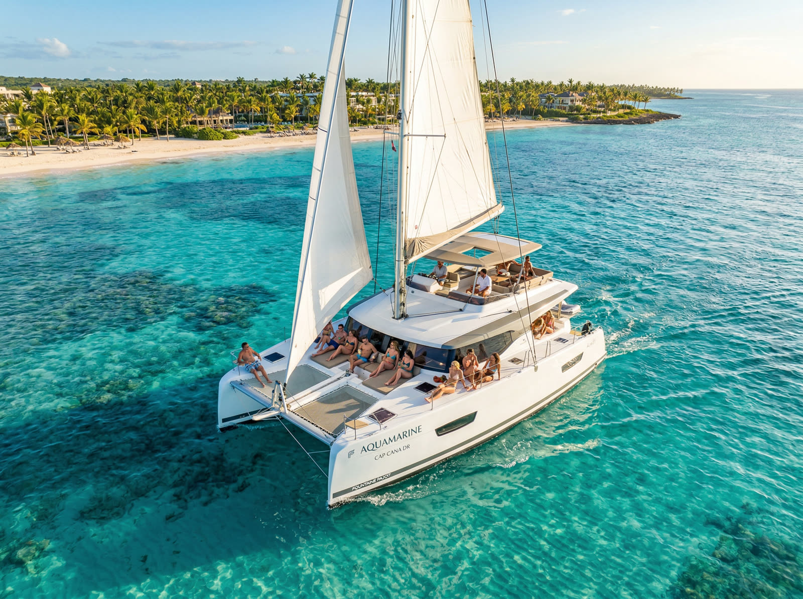 Private catamaran sailing turquoise Caribbean waters with snorkeling and open bar