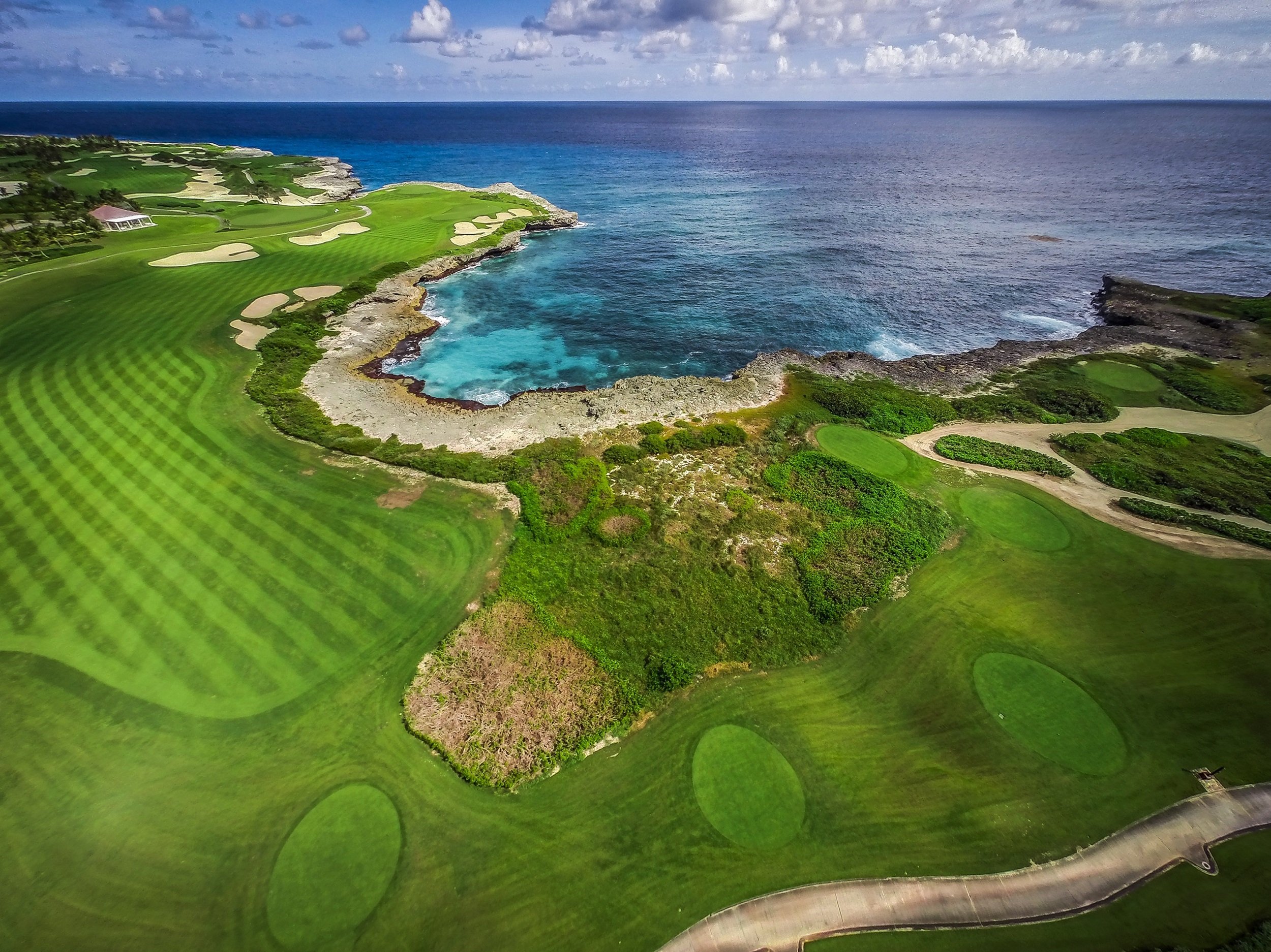 Corales Golf Course — 18th hole with ocean cliff carry, Punta Cana